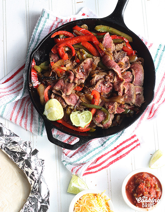 Tasty flat iron steak is marinated for up to 24 hours for maximum flavor. Serves this sizzling steak fajita recipe with sauteed vegetables and your fave toppings.
