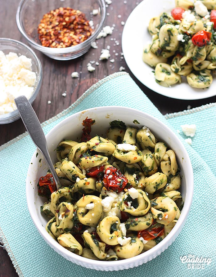 This tortellini sauce has a some Latin American flair. Tomatillos are roasted with garlic and olive oil, blended with fresh spinach and roasted tomatoes, then tossed with queso fresco cheese.