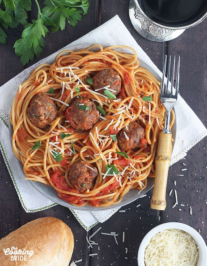 plate of pasta and tomato sauce topped with venison meatballs
