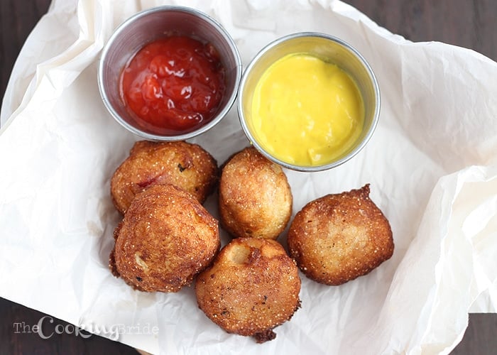 Mini corn dogs are a bite-sized version of a snack time favorite. Sliced hot dogs are coated in flour and cornmeal batter and fried until golden brown.