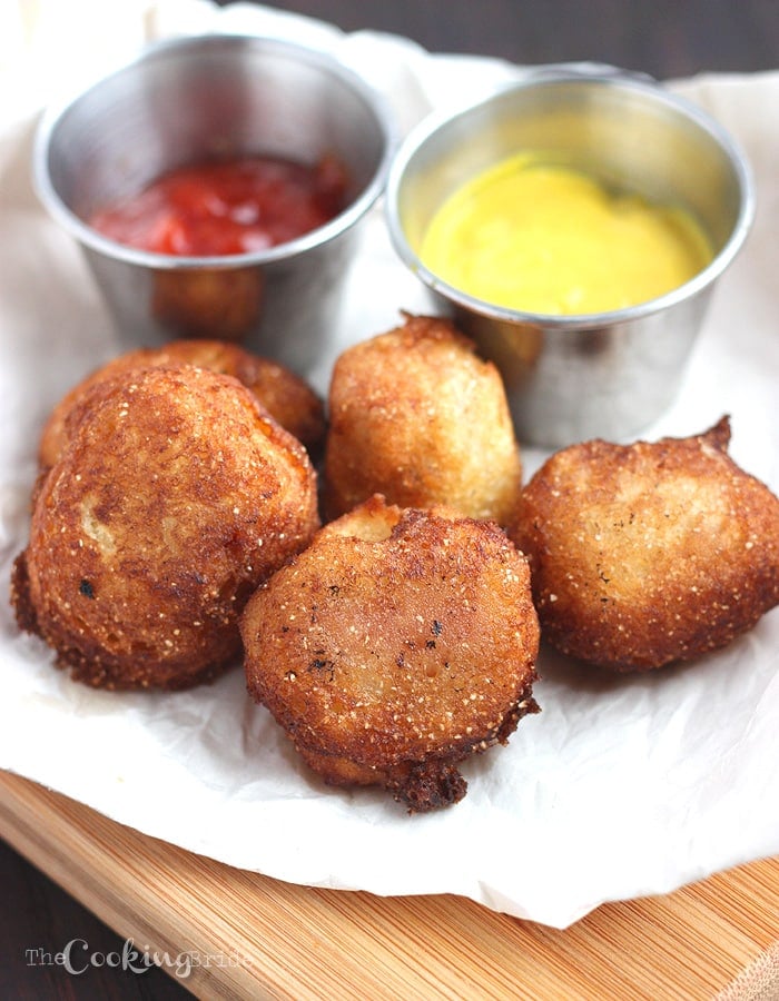 Mini corn dogs are a bite-sized version of a snack time favorite. Sliced hot dogs are coated in flour and cornmeal batter and fried until golden brown.