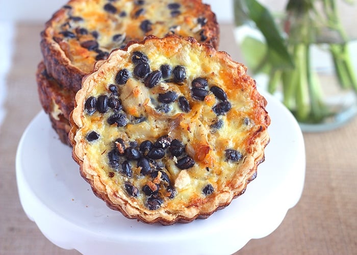 Looking for more hearty quiche fillings? Shredded chicken breast, black beans, and smoked cheddar make this a little more robust than your average quiche.