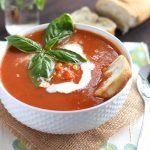 Warm up with the fresh flavors of this creamy tomato basil soup recipe. It's full of late summer bounty with fresh basil, sweet corn, and juicy tomatoes.