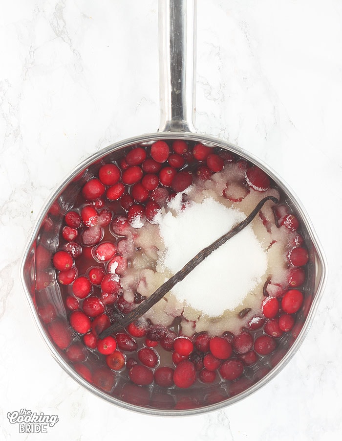 cranberry sauce ingredients in a stainless steel saucepan