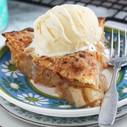 granny smith apple pie with ice cream on a plate