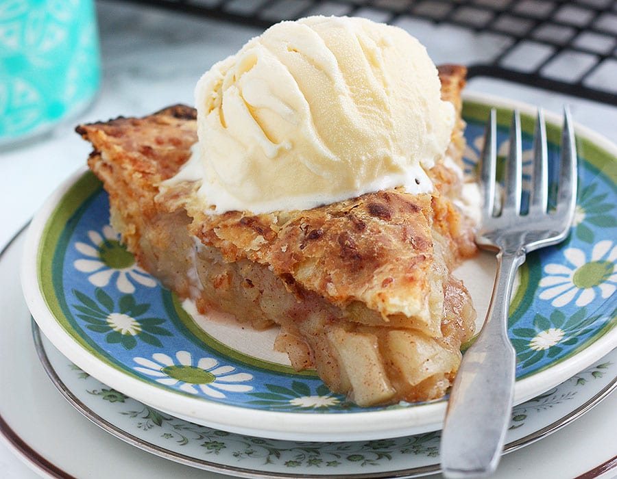 granny smith apple pie with ice cream on a plate