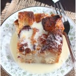 Bread pudding recipe is over the top delicious with dried cranberries and white chocolate chips and drizzled with warm rum creme anglaise sauce.