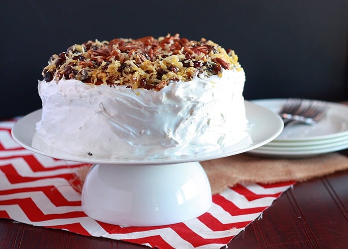 A forgotten Southern classic, Amalgamation cake is filled with raisins and coconut, iced with homemade frosting and garnished with more coconut and raisins.