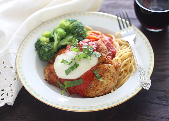 This easy chicken Parmesan recipe is simple enough for a weeknight meal! Chicken cutlets are dredged in egg, breadcrumbs, and Parmesan cheese, then fried until crispy and golden brown.