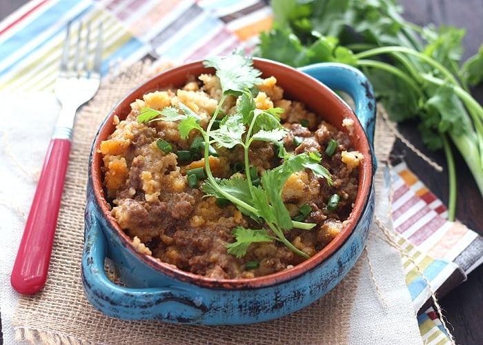 Slow cooker tamale pie casserole has all the flavor of an actual tamale without all the work. Seasoned ground beef is topped with tender masa harina.