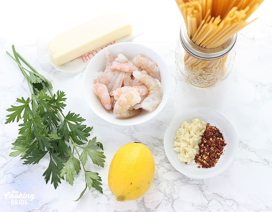shrimp scampi ingredients on a white marble background