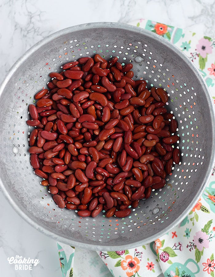red beans in a metal skillet sitting on a floral napkin