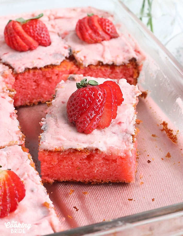 close up shot of a slice of strawberry sheet cake