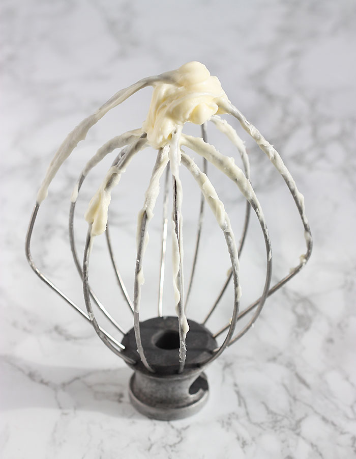 whisk with cream cheese icing