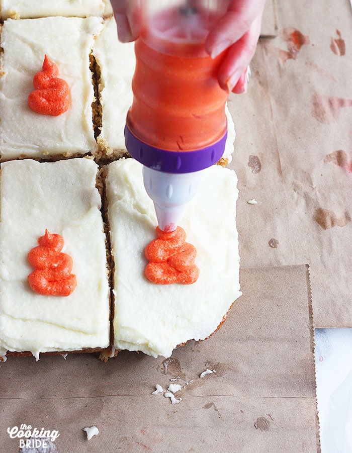 decorating carrot cake with icing