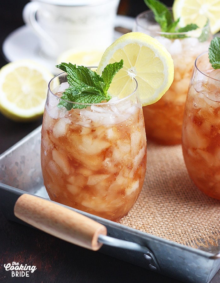 side view of a mint julep cocktail on a metal tray