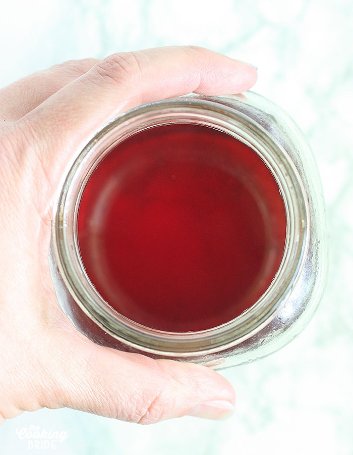 strained cherry vodka in a mason jar