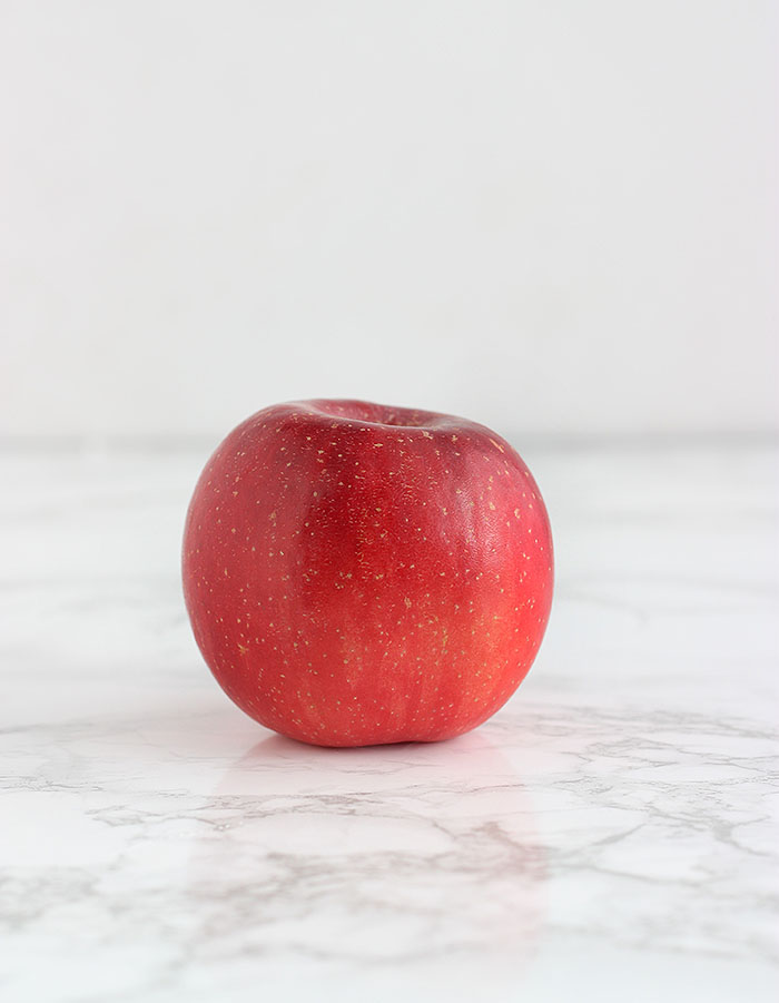 red fuji apple on a white background