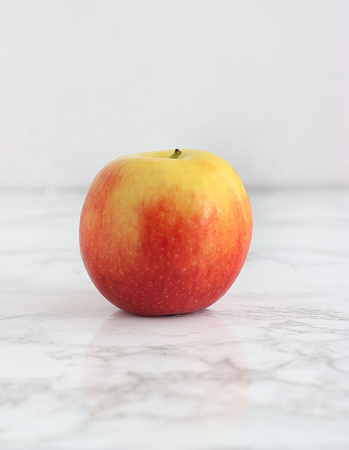 yellow and pink jazz apple on a white background