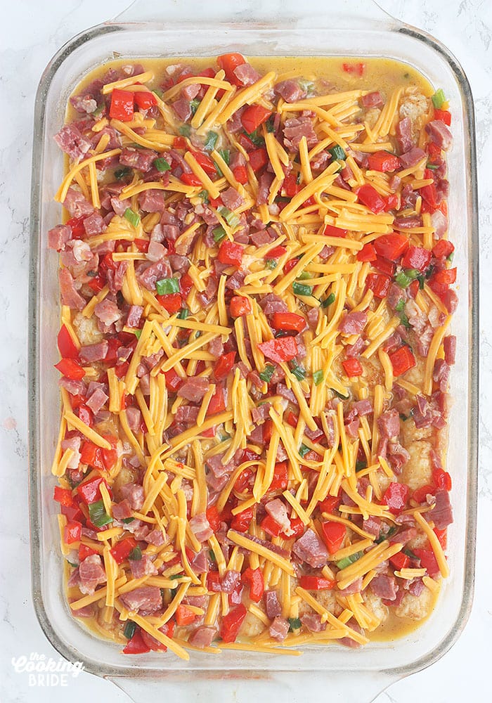 unbaked ham and cheese casserole on a white background