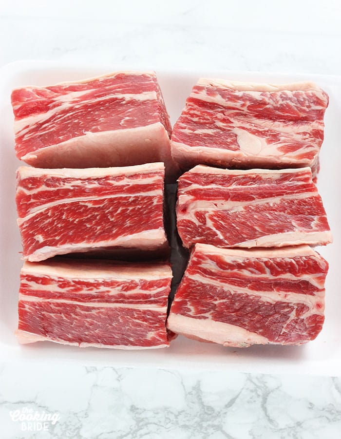 Raw shortribs on a white background
