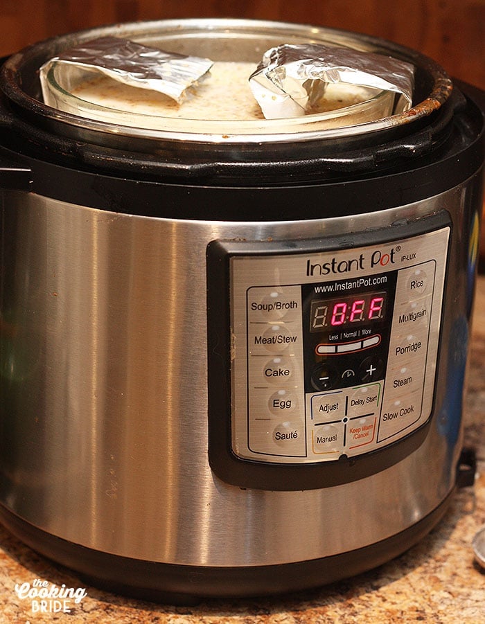 instant pot with grits cooking on the top