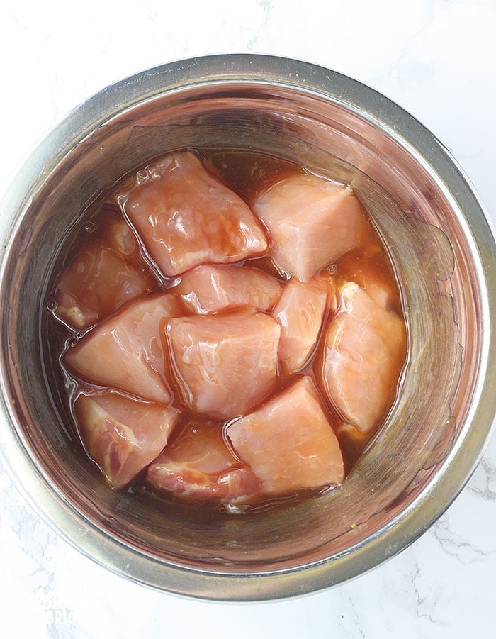pork skewers marinating in glaze