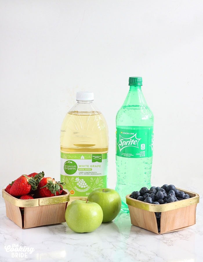 berry punch ingredients including fresh strawberries, green apples, blueberries, white grape juice and sprite