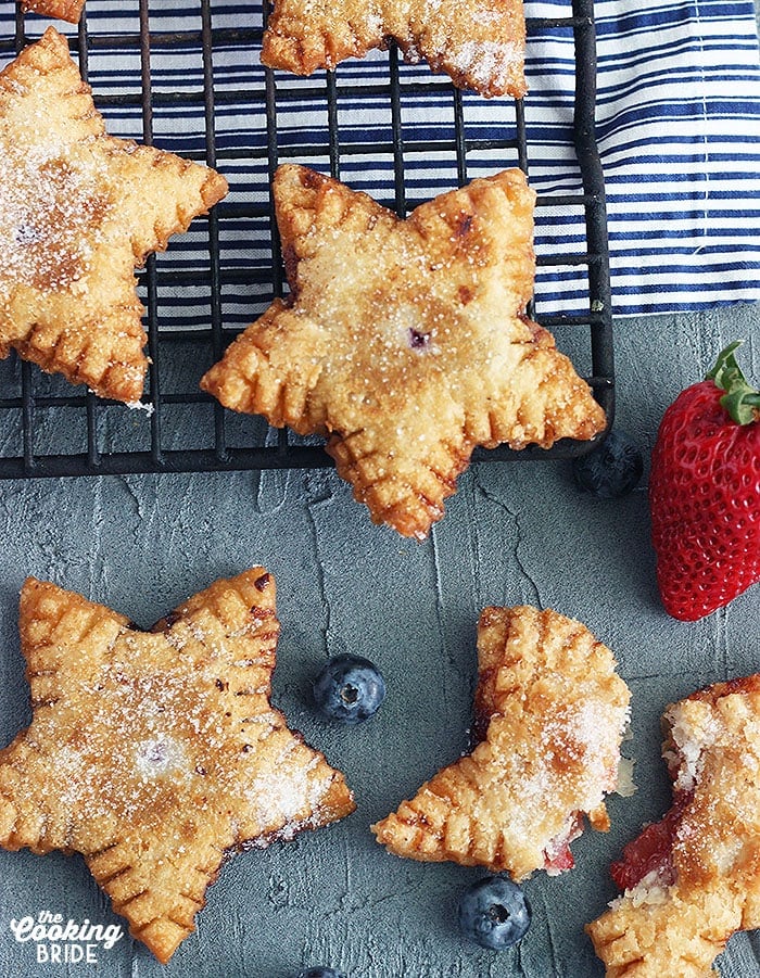 Star shaped fried pies cooling on a baking rack