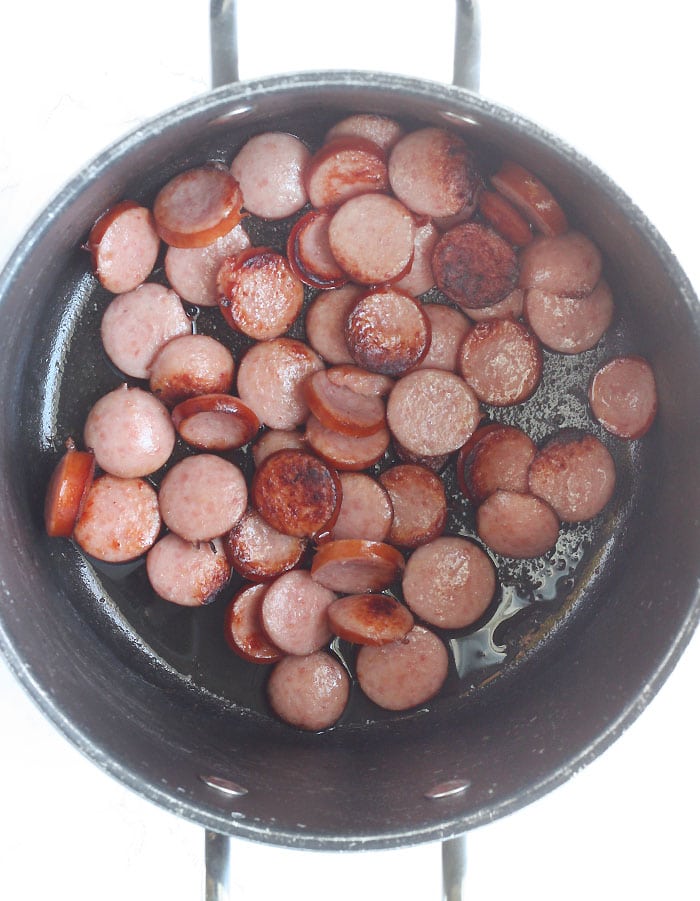browning the smoked sausage in a large stock pot