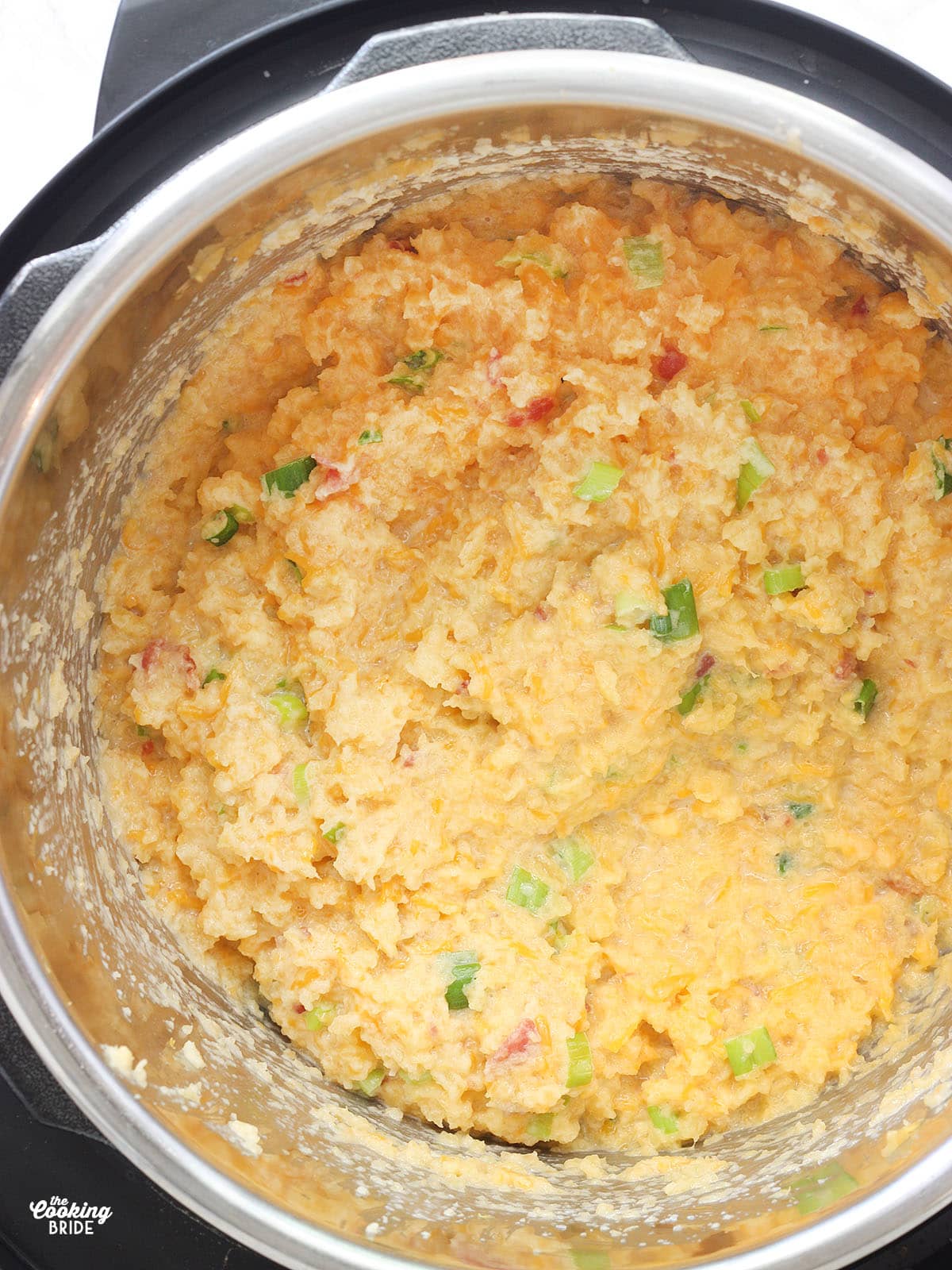 mashed rutabaga with cheese, green onions and bacon in an Instant Pot