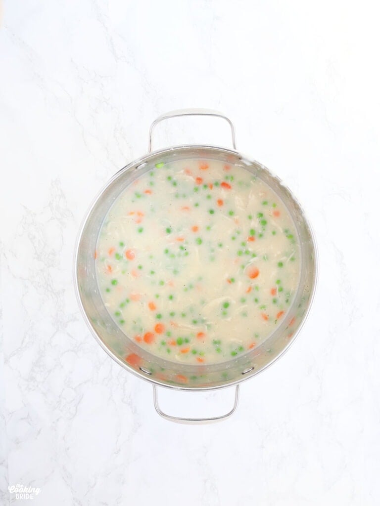 overhead shot of pot pie filling in a stainless steel stock pot