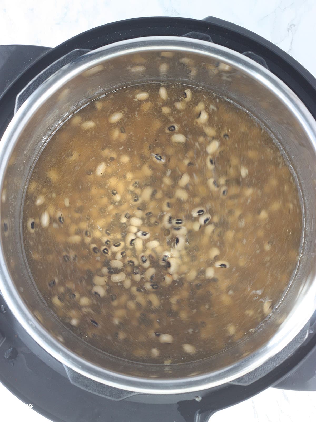 Black-eyed peas and broth after presoaking in an Instant Pot