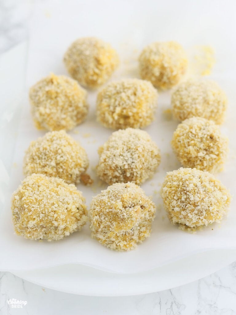 boudin balls coated in Panko breadcrumbs waiting to be fried