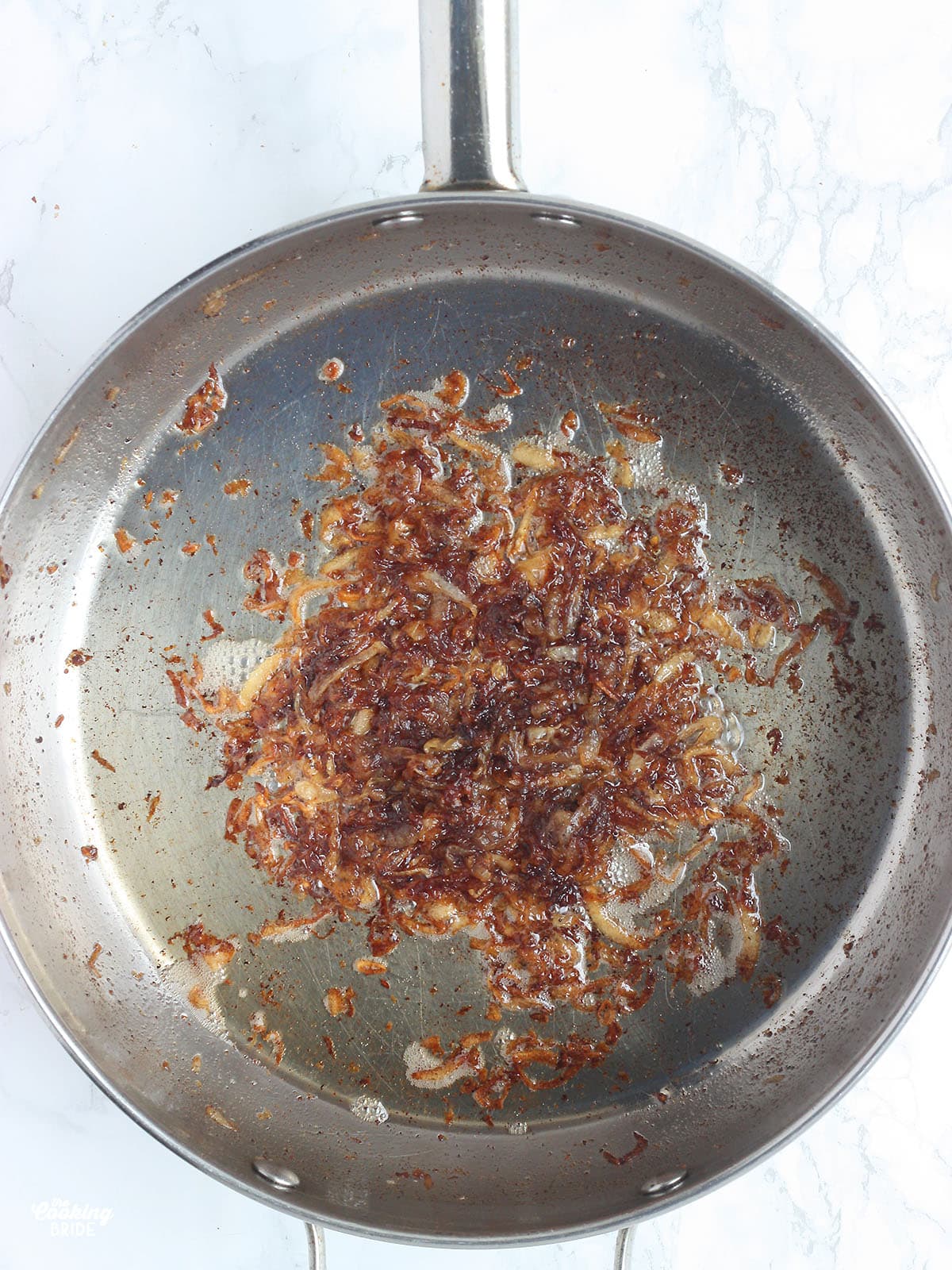 caramelized onions in a stainless steel skillet