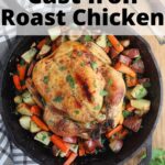 overhead shot of cast iron roast chicken with roasted vegetables