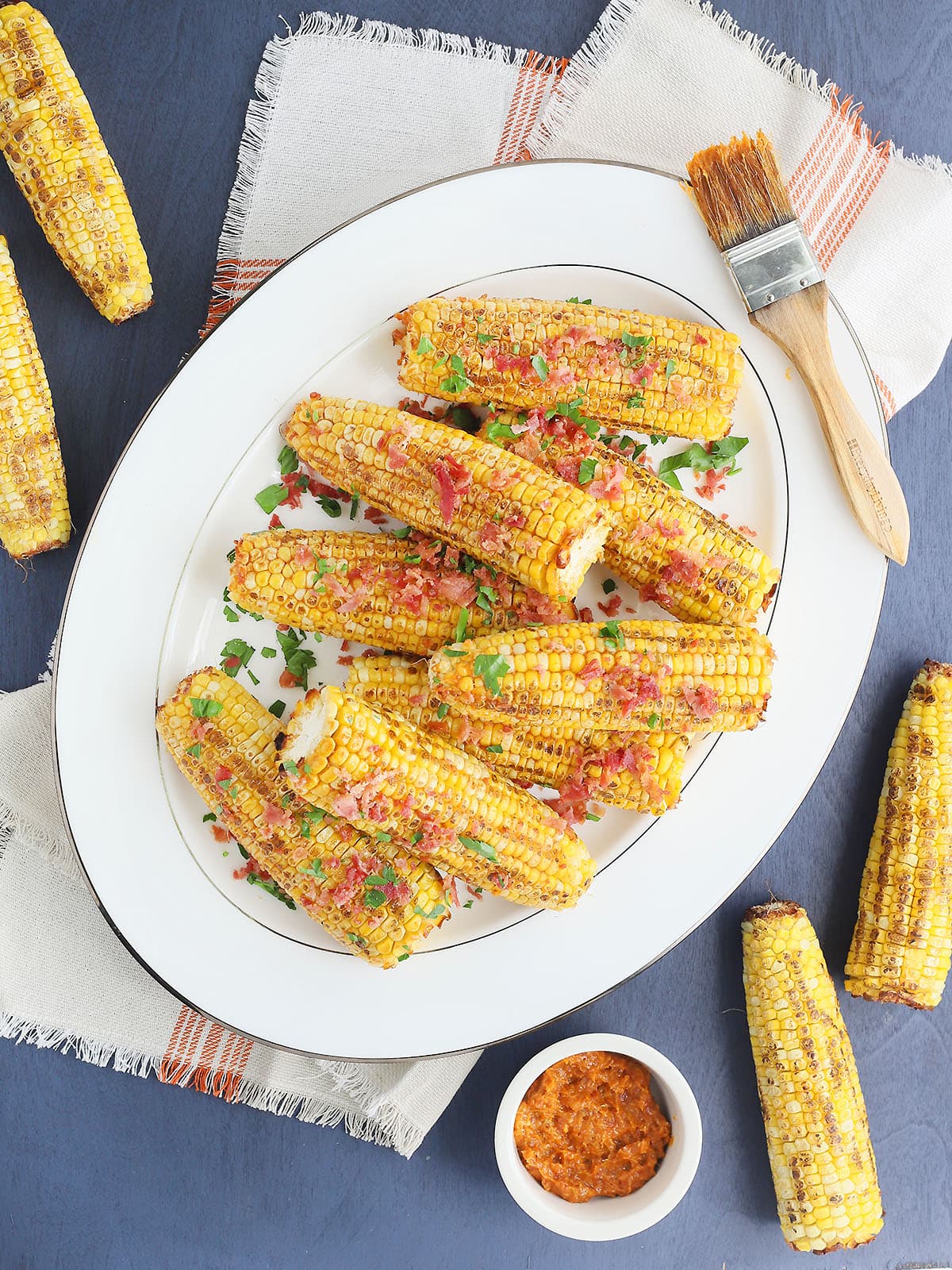 roasted corn with bacon butter on a large white platter