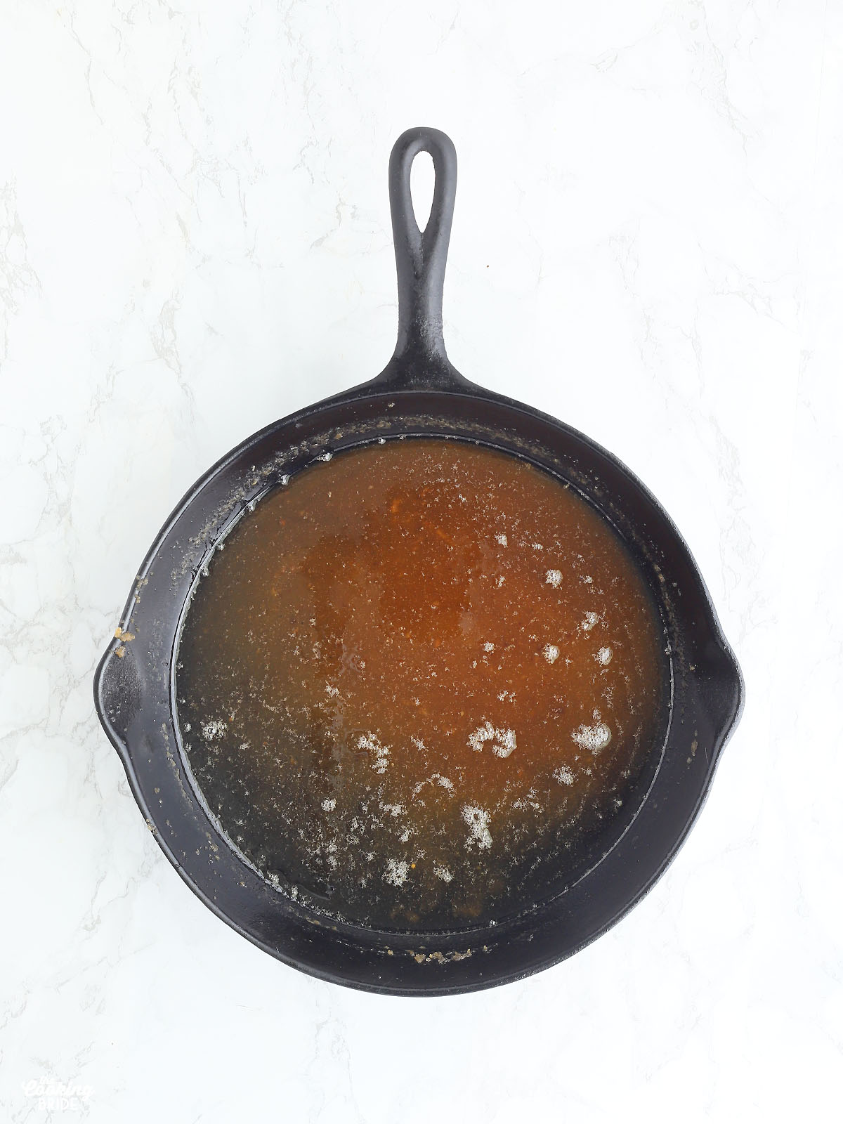 melted butter and brown sugar in a cast iron skillet