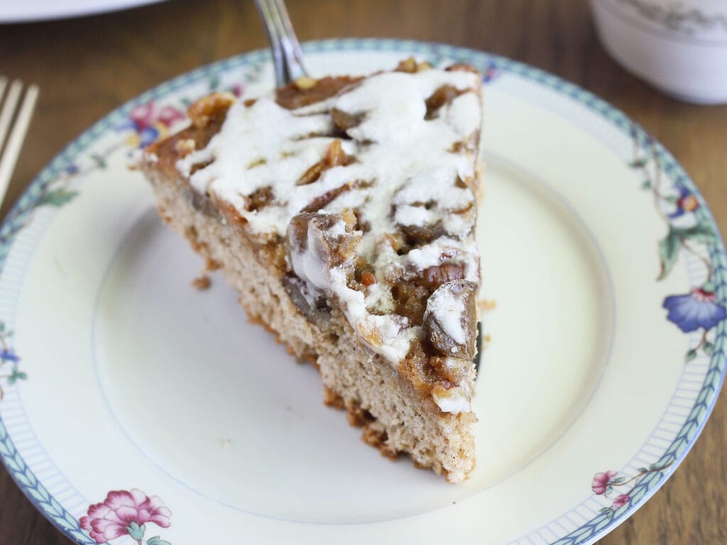 slice of fig cake being served on a blue and white floral plate