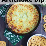 overhead shot of baked artichoke dip in a cast iron skillet