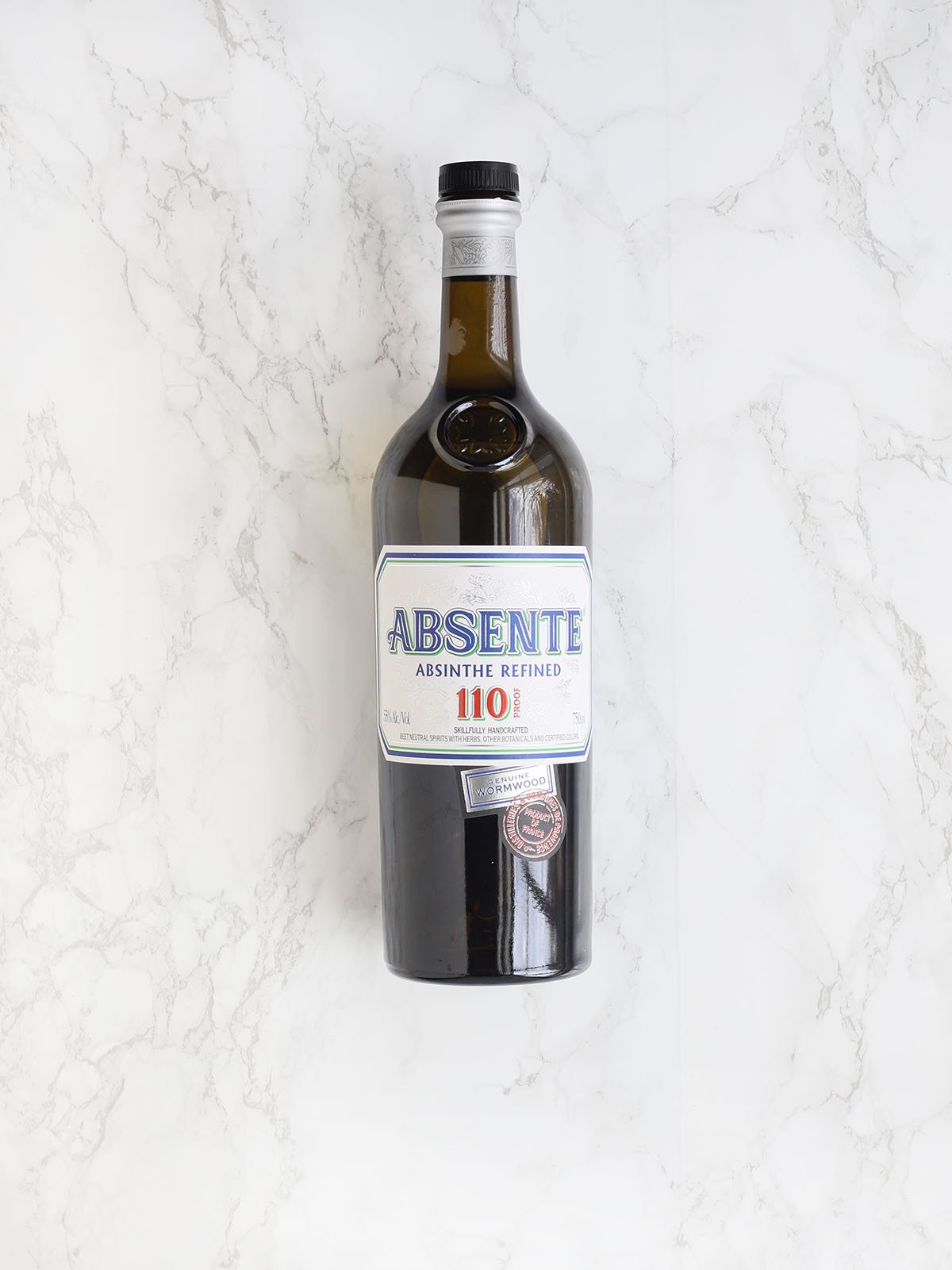 bottle of absinthe on a marble background