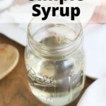 mason jar of simple syrup on a wooden background