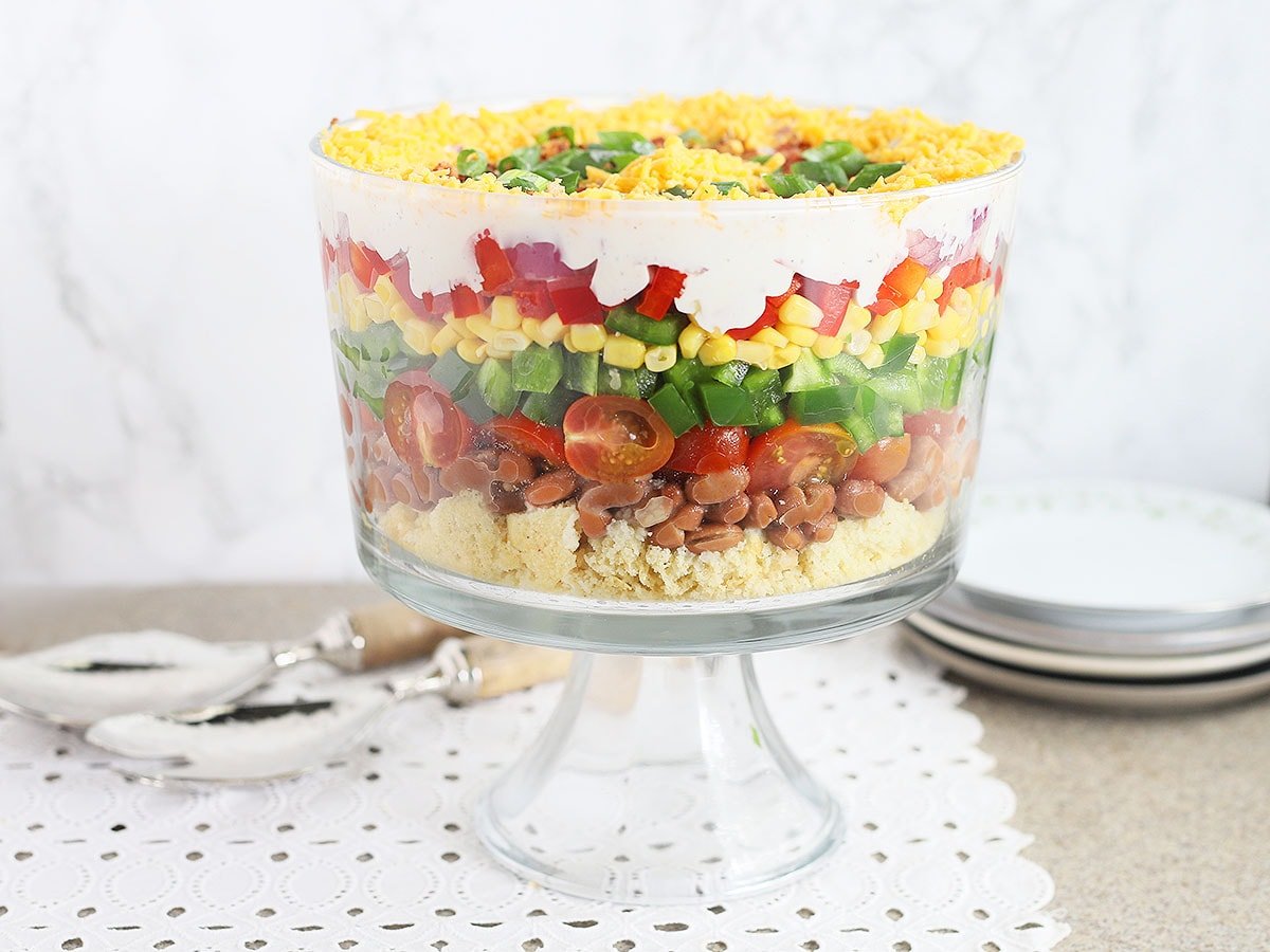 cornbread salad in a clear glass trifle bowl