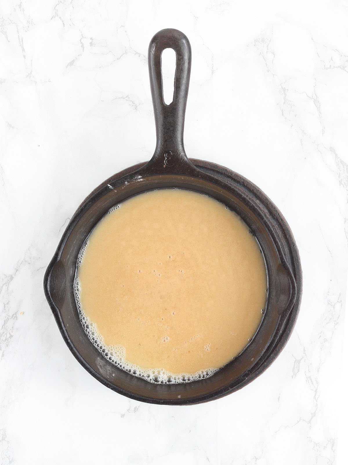White roux in a cast iron skillet.