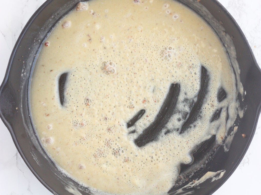 makings of a roux in a cast iron skillet
