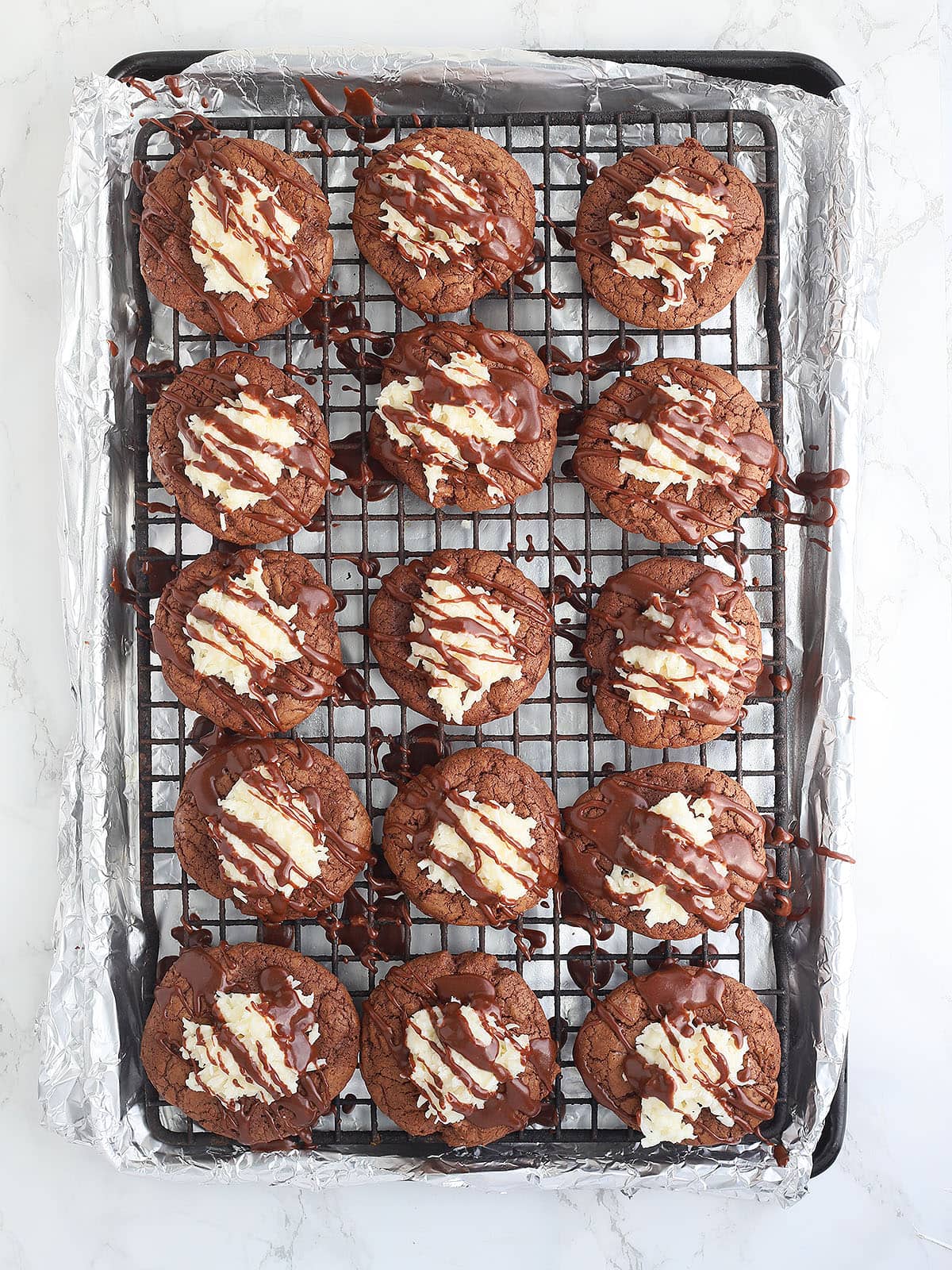 almond joy cookies after they have been drizzled with chocolate