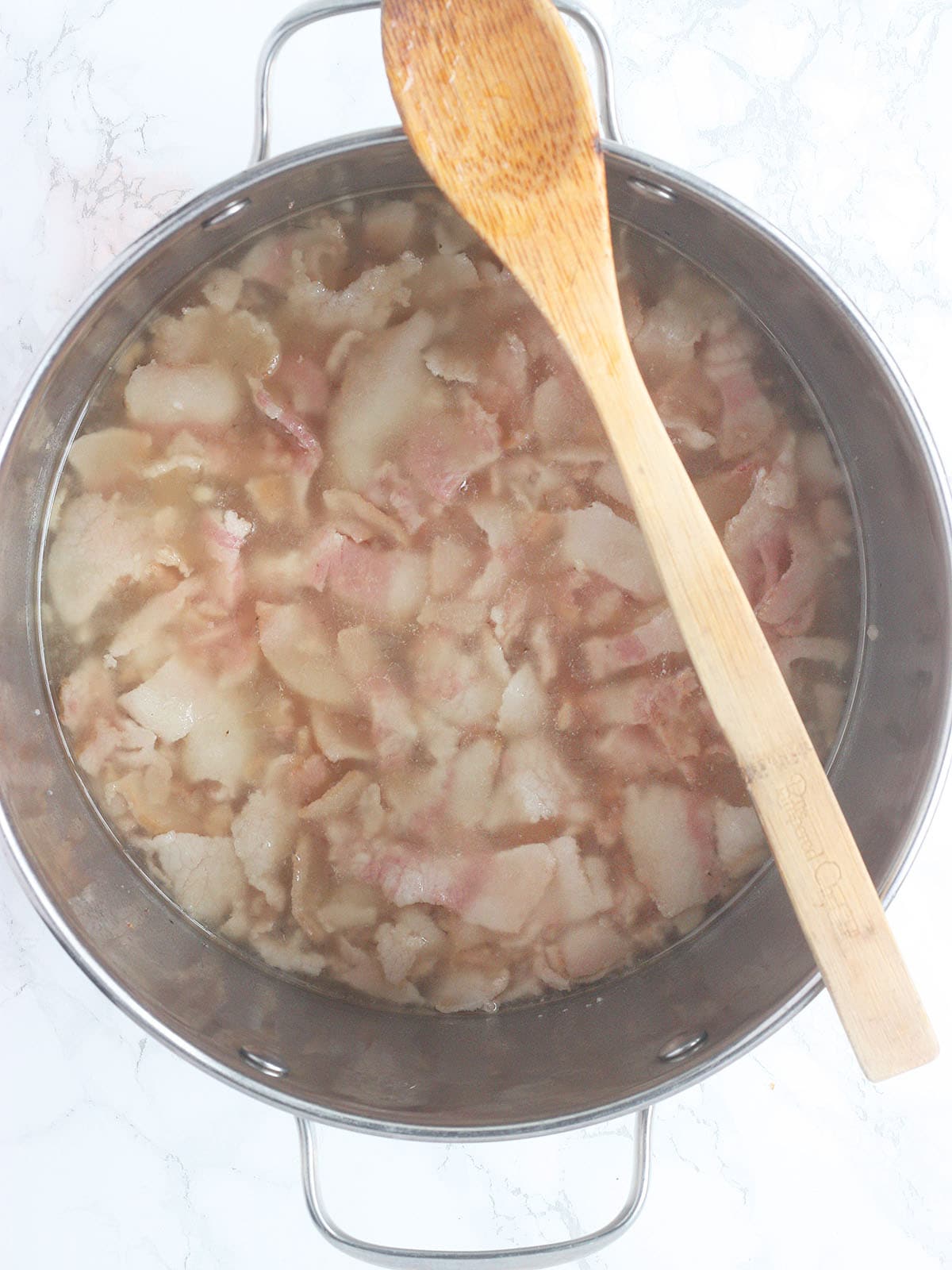 Cooked salt pork after the water has been added to the pot.