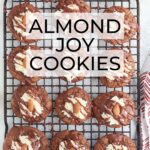 almond joy cookies on a baking with a red and white napkin to the side