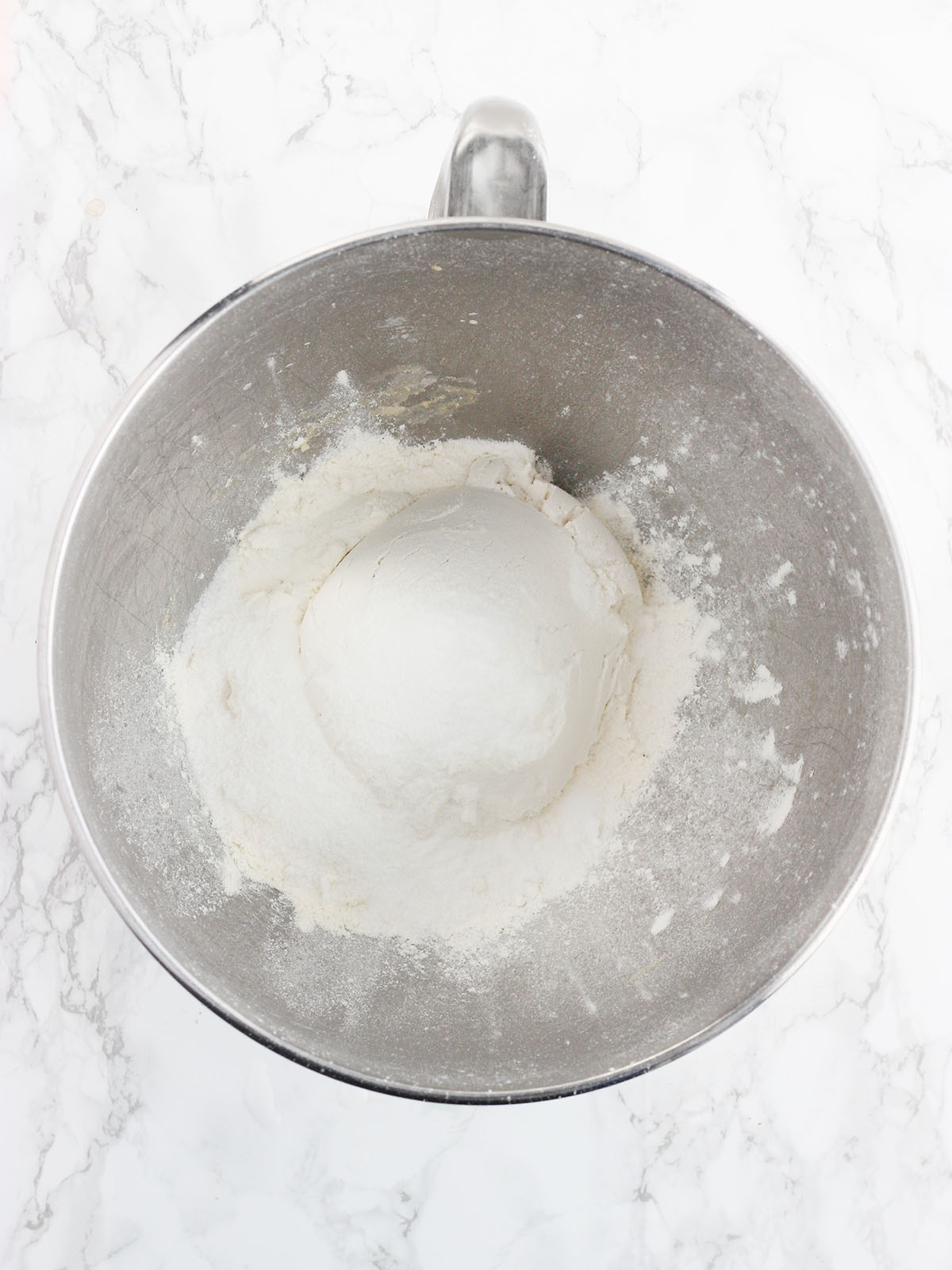 flour and sugar in a metal mixing bowl