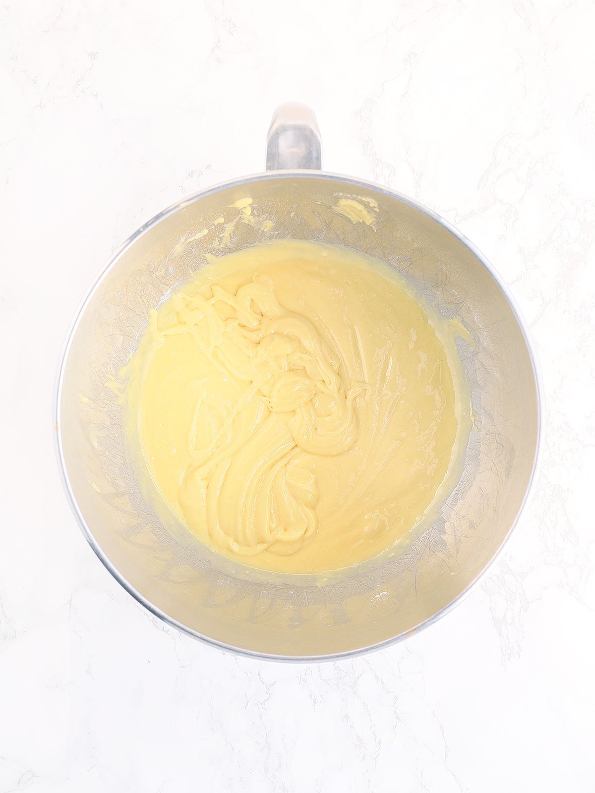 Cake mix, oil and apricot nectar mixed together in a metal bowl